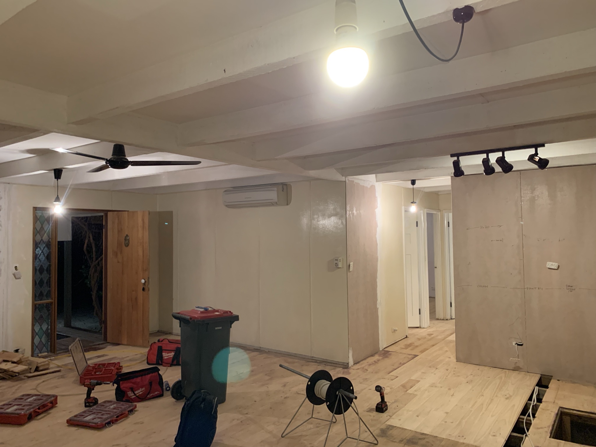 Renovation fit out with a ceiling fan, track lighting, pendants and a split system head installed